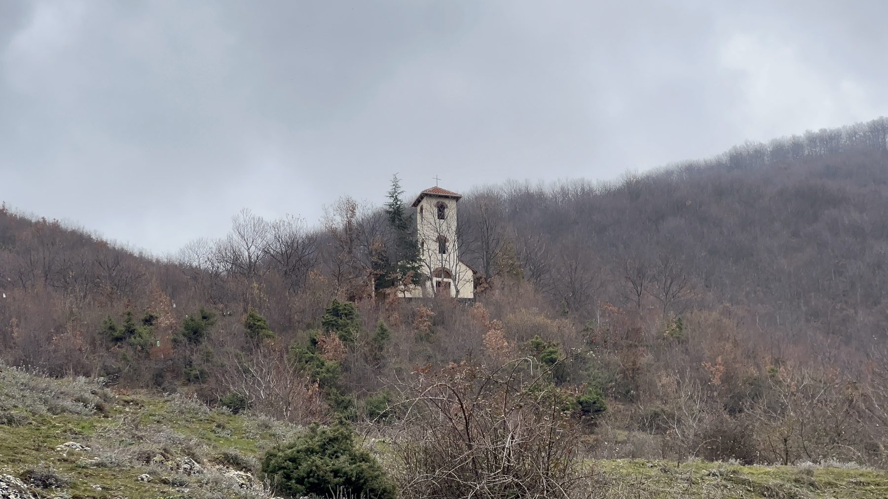 Kisha Shën e Diela, the old church of Kabash, seen from down the ridge on the Kabash Trail